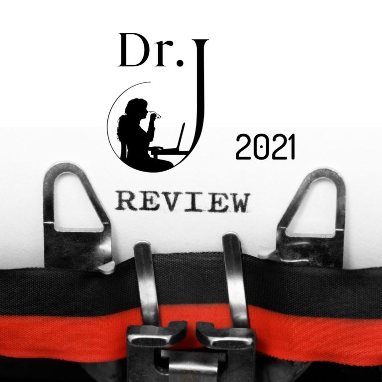 Sheet of paper in typewriter with words Dr. J. review 2021