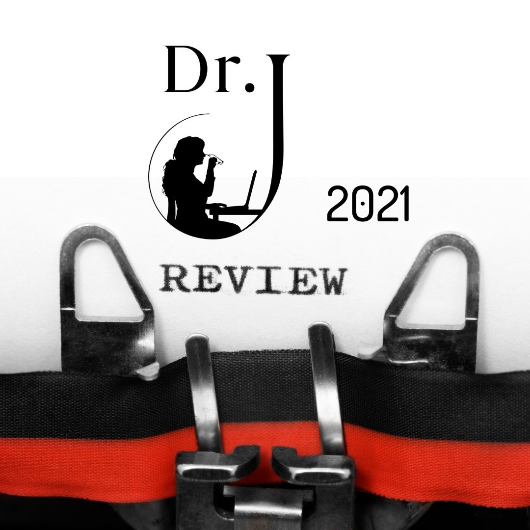 Sheet of paper in typewriter with words Dr. J. review 2021